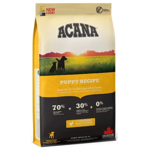 Acana Puppy Recipe 11.4 kg dog food bag featuring fresh chicken and a vibrant countryside background.